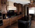 Dark Brown Cabinets with Black Backsplash