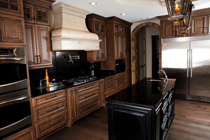 Dark Brown Cabinets with Black Backsplash